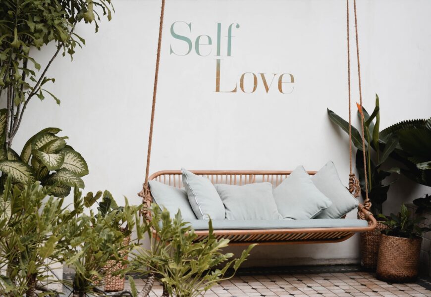 brown rattan swing bench with cushions