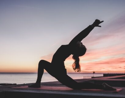 silhouette photography of woman doing yoga