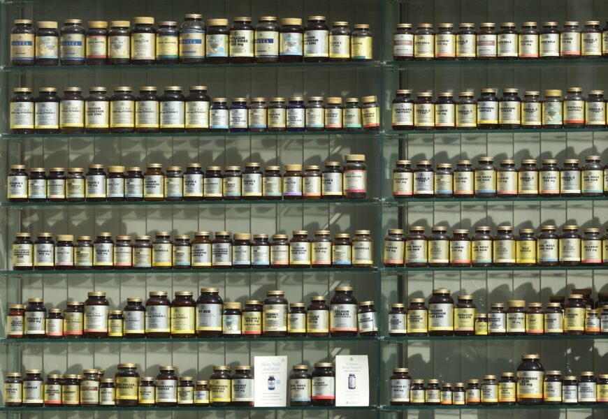 assorted labeled bottle on display shelf