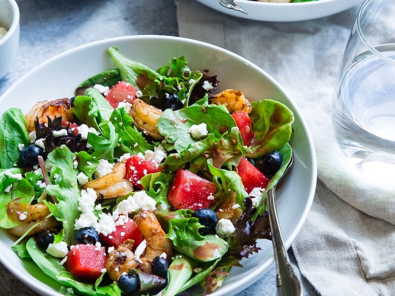 vegetable salad on white ceramic bowl