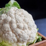 white cauliflower on black textile