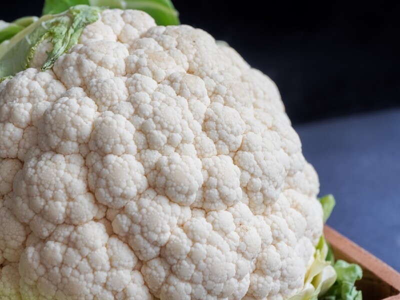 white cauliflower on black textile